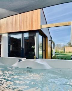 a large bath tub in front of a house at River Bann Retreat in Portglenone