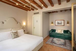 Cama ou camas em um quarto em Daplace - Antica Casa Coppo