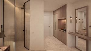 a bathroom with a walk in shower and a sink at The Wave in Sidari