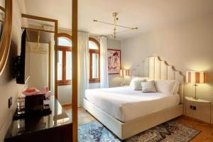 Cama ou camas em um quarto em Daplace - Antica Casa Coppo