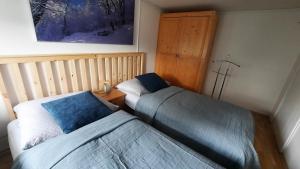 Rúm í herbergi á Apartmán Franz Josef
