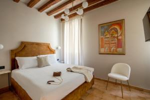 Cama ou camas em um quarto em Daplace - Antica Casa Coppo