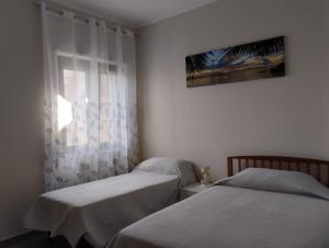 מיטה או מיטות בחדר ב-Casa Vacanze da Giovanna