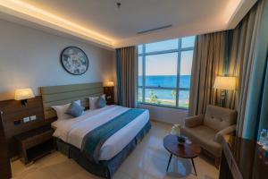 a hotel room with a bed and a window at فندق كورال ريف coral reef hotel in Al Wajh +26 photos