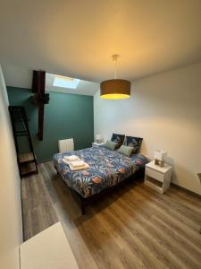 Ένα ή περισσότερα κρεβάτια σε δωμάτιο στο Appartement Cosy dans le coeur de Witry-les-Reims