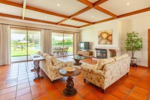 a living room with two couches and a fireplace at Solar de Prado - Minho's Guest in Vila de Prado