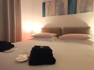 Postel nebo postele na pokoji v ubytování Rose Antiche Vatican B&B