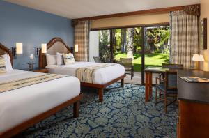 Ένα ή περισσότερα κρεβάτια σε δωμάτιο στο Catamaran Resort Hotel and Spa