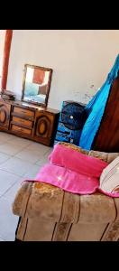 a bedroom with a bed with a mirror and a bed sidx sidx sidx at Fullmoon Guasacate House in Popoyo