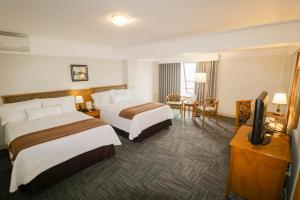 Postel nebo postele na pokoji v ubytování Hotel Miramar