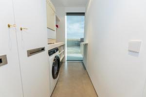 a laundry room with a washer and dryer at Chalet Els pins, Banyoles in Banyoles