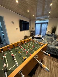 a conference room with a table with a soccer ball on it at Charming Heywood retreat house in Heywood