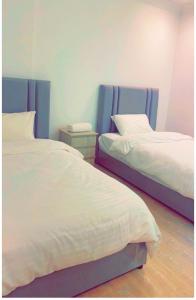 Postelja oz. postelje v sobi nastanitve Alwaha-Appartement
