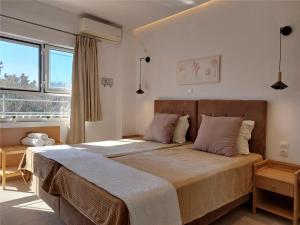 A bed or beds in a room at Sand and Sea