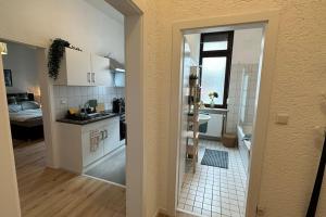 an open door to a kitchen with a bathroom at Limburgs Herzstück in Limburg an der Lahn