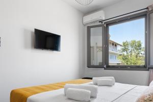 TV a/nebo společenská místnost v ubytování Dimargi Apartments