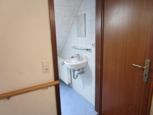 a bathroom with a sink and a toilet at Ferienwohnung Am Homburg Nr 1 in Saarbrücken