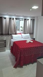 En eller flere senge i et værelse på Paradise Beach Flats