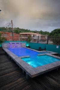 a swimming pool on the roof of a building at Hotel Boutique Calizo vip in Fajardo