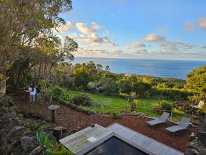 a view of the ocean from the backyard of a house at Waka Sun Set PICO AZORES in São Roque do Pico