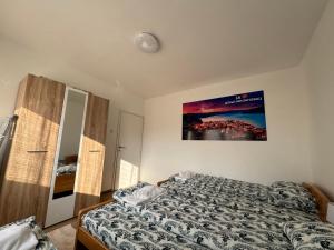 Voodi või voodid majutusasutuse Vuk Apartman toas