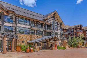 a large apartment building with a balcony at Hayden Lodge by Snowmass Mountain Lodging in Snowmass Village