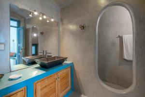 a bathroom with a sink and a mirror at Elicriso Villa in Pyrgos