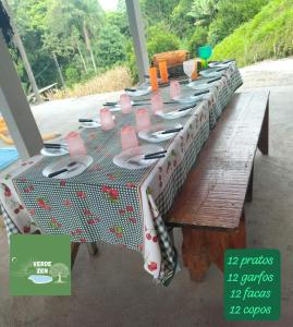 a table with a table cloth on top of it at Refugio Verde Zen in Dois Vizinhos