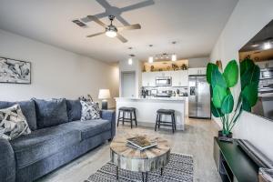 a living room with a couch and a table at Modern Luxury Condo on Riverwalk #1335 in San Antonio
