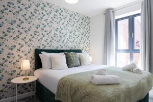 a bedroom with a bed with a stuffed animal on it at Rest&Recharge at Brookdale House (5 Bedrooms, 15mins to City Centre, Free Parking) in Manchester