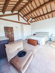 Łóżko lub łóżka w pokoju w obiekcie Antico Casolare Gregori
