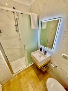 a bathroom with a sink and a shower at Nea Terrace in Naples