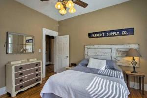 a bedroom with a bed and a dresser and a mirror at Downtown Boone ON King Street - 2 Bedroom Home in Boone