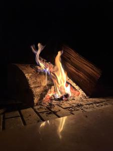 a fire is burning in a brick oven at Villa Athamanio - Premium in Athamanio +1 photo