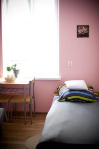 A bed or beds in a room at Noclegi na Wzgórzu Zamkowym