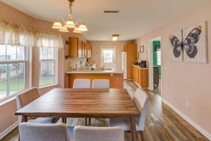 a kitchen and dining room with a wooden table and chairs at Best spot for you and the family in Sevier County in Pigeon Forge
