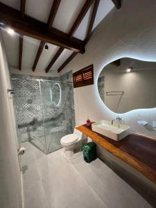 a bathroom with a sink and a toilet and a shower at CABAÑA TAYRONACA in Calabazo