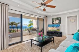 a living room with a couch and a tv at Kaanapali Alii 255 in Lahaina