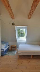 En eller flere senge i et værelse på Lynæs villa B&B