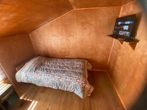 Llit o llits en una habitació de Hospedaje Alto Palena de Puerto Cisnes
