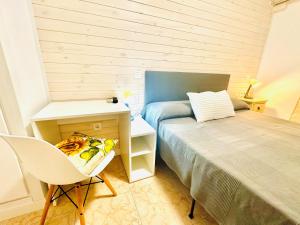 Postel nebo postele na pokoji v ubytování Hostal La Taberna
