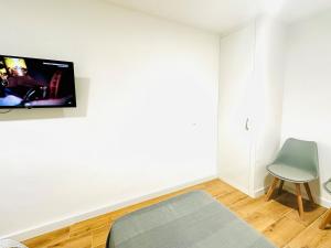TV a/nebo společenská místnost v ubytování Hostal La Taberna