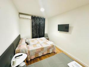 Postel nebo postele na pokoji v ubytování Hostal La Taberna