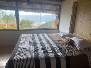 A bed or beds in a room at Casa “La Kampamocha”