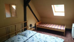 Posteľ alebo postele v izbe v ubytovaní Chalupa U Potoka