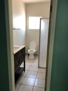 a bathroom with a toilet and a sink and a shower at Almejas B in San Carlos