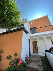 a house with a car parked in front of it at Chaka2 in Tonalá