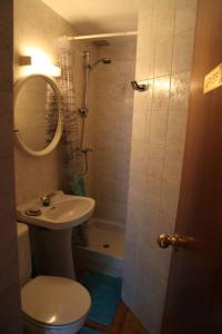 a bathroom with a sink and a toilet and a shower at 2 bedrooms appartement with terrace and wifi at Arinsal in Mas de Ribafeta