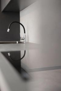 a kitchen counter with a sink and aaucet at Athens centre in Athens
