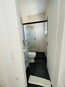 a bathroom with a toilet and a shower at VILLA THEIA - SELENE , appartement de charme pour 4 à 6 personnes prés de la plage et du village de Koufonissi in Koufonisia